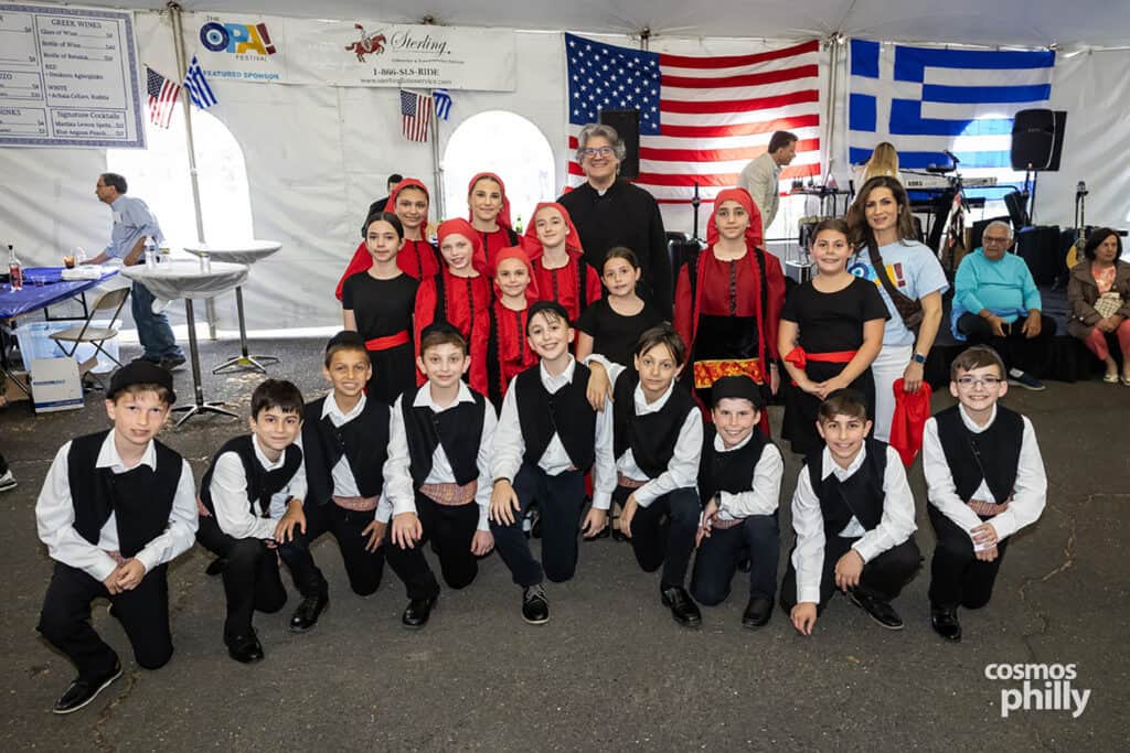 Greek dancers in traditional costumes at the 2026 OPA! Festival in Elkins Park.
