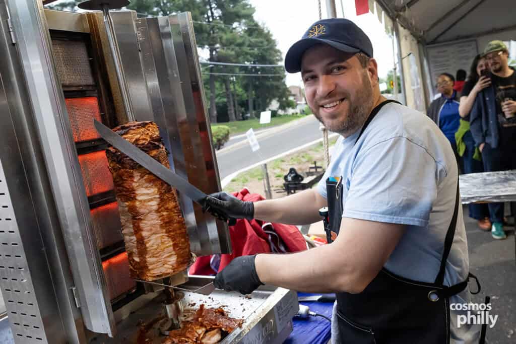 Parish volunteers serve guests during the 2026 OPA! Festival at Annunciation Greek Orthodox Church.
