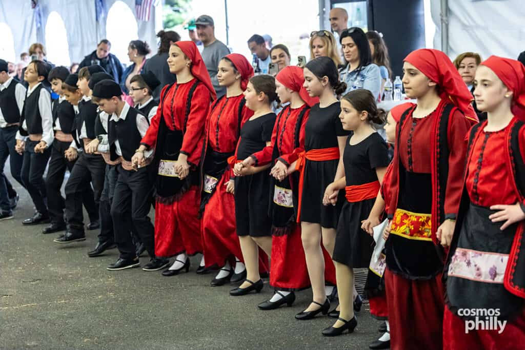 Greek dancers perform in traditional costumes at the 2026 OPA! Festival in Elkins Park.
