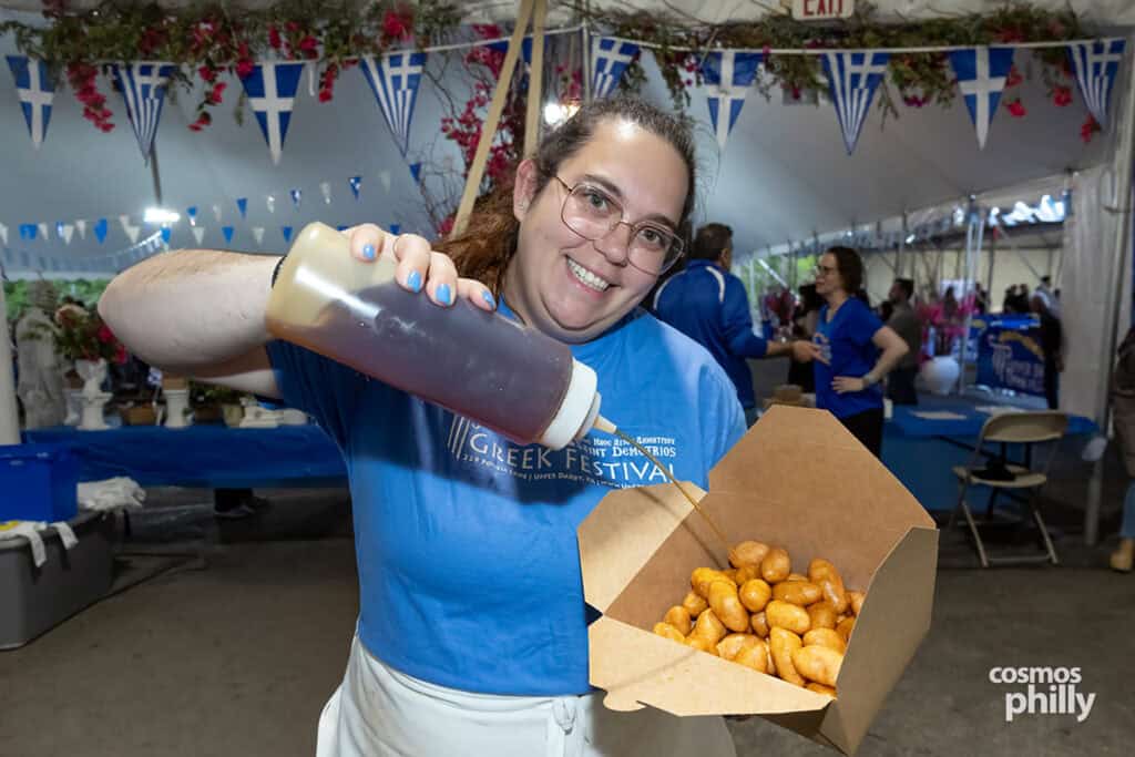 Scenes from the St. Demetrios Greek Wine and Food Festival in Upper Darby, with guests, food, dancing, volunteers, and activity under the festival tent.
