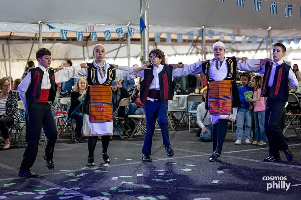 Scenes from the St. Demetrios Greek Wine and Food Festival in Upper Darby, with guests, food, dancing, volunteers, and activity under the festival tent.