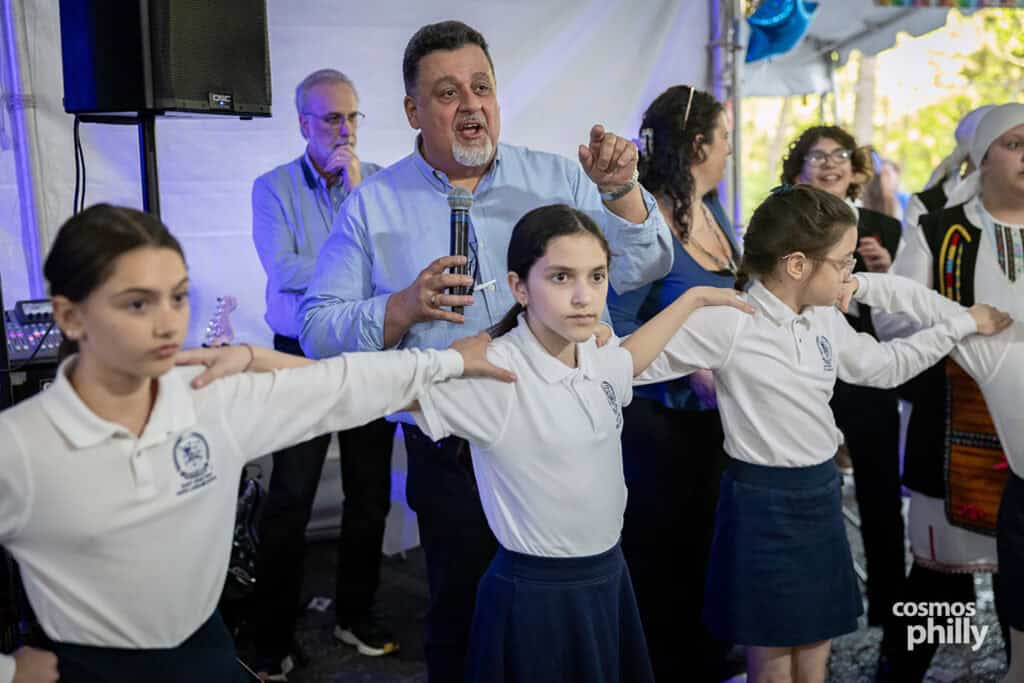 Scenes from the St. Demetrios Greek Wine and Food Festival in Upper Darby, with guests, food, dancing, volunteers, and activity under the festival tent.