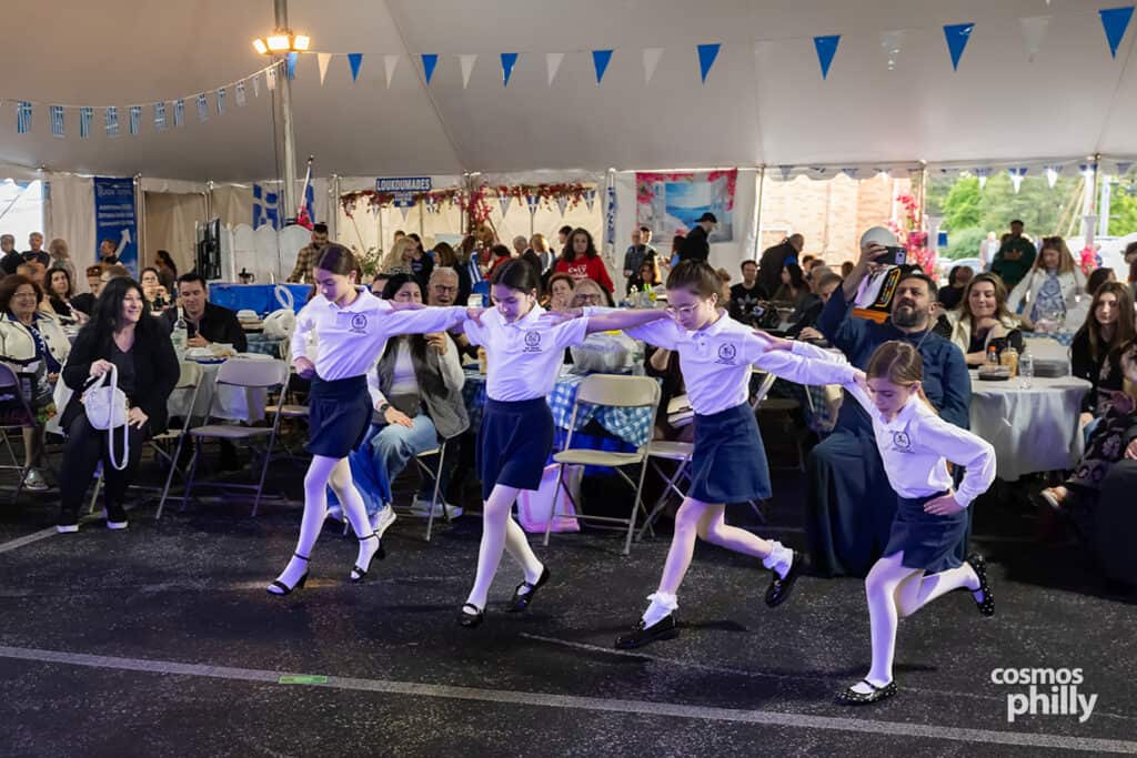 Scenes from the St. Demetrios Greek Wine and Food Festival in Upper Darby, with guests, food, dancing, volunteers, and activity under the festival tent.