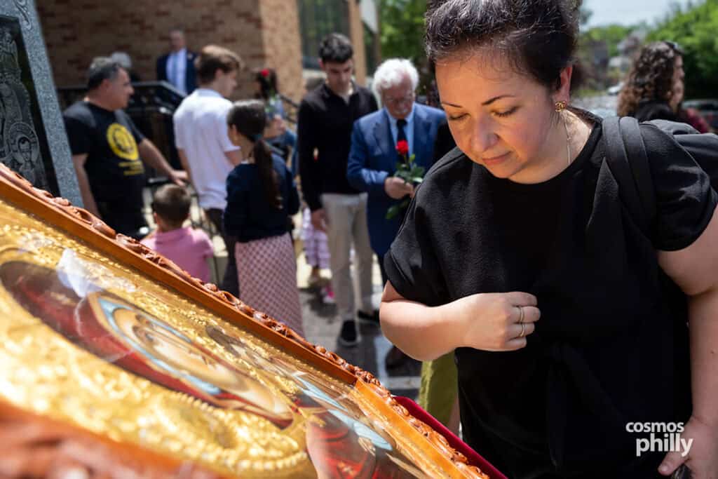 A woman bows before the icon of Panagia Soumela during the Pontian Genocide commemoration at St. Demetrios.
