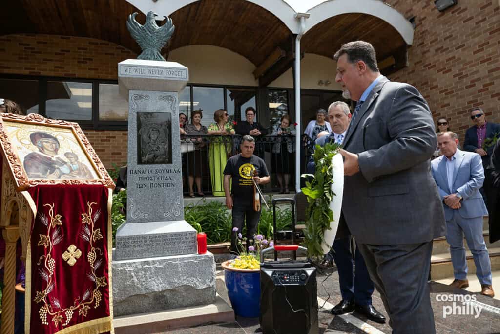 A wreath is placed at the Pontian Genocide monument beside the icon of Panagia Soumela at St. Demetrios.