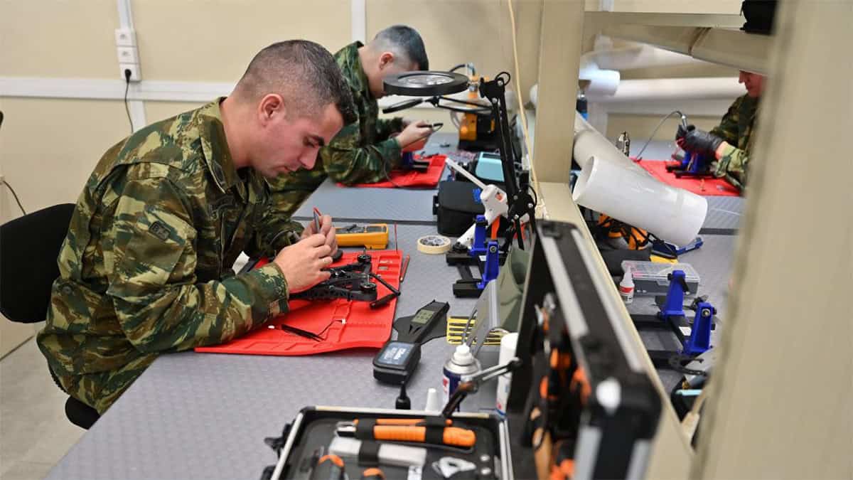 Greek military personnel work on drone components inside an Armed Forces production facility.