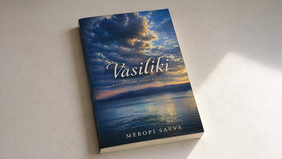 Paperback copy of Vasiliki: A Novel of Love, Secrets and Revenge by Meropi Savva on a light tabletop.