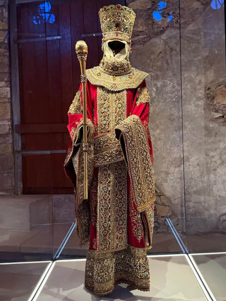 Court garment inspired by Helena Dragas displayed inside the Palace of the Despots in Mystras