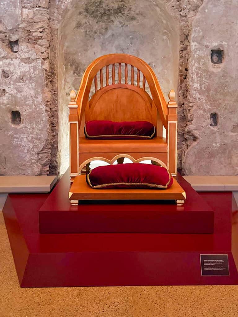 Throne display inside the restored Palace of the Despots in Mystras