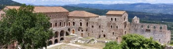 The Palace of the Despots in Mystras, Greece, seen from above with the Laconian landscape in the background
