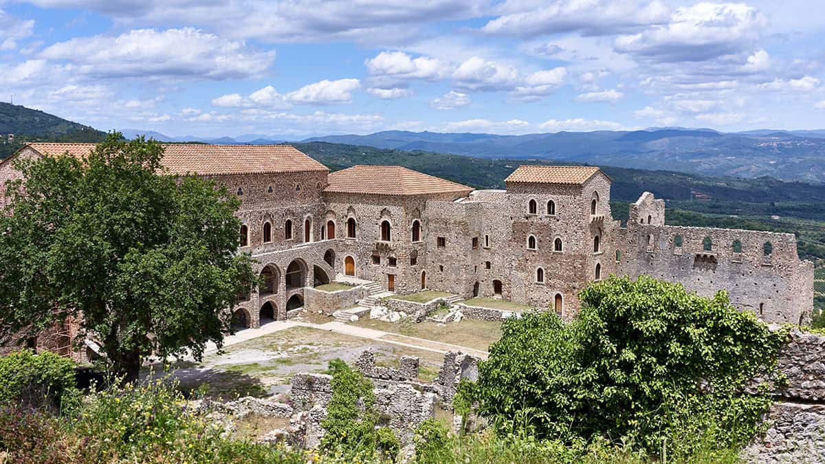 The Palace of the Despots in Mystras, Greece, seen from above with the Laconian landscape in the background