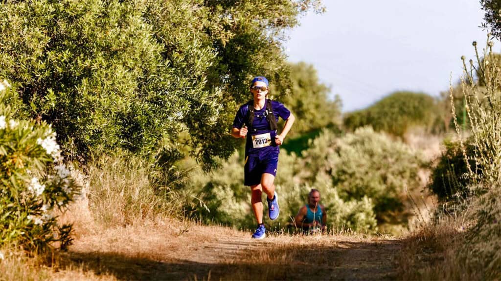 A runner follows a route through the vineyards and hills of Sithonia during Porto Carras Athlos.