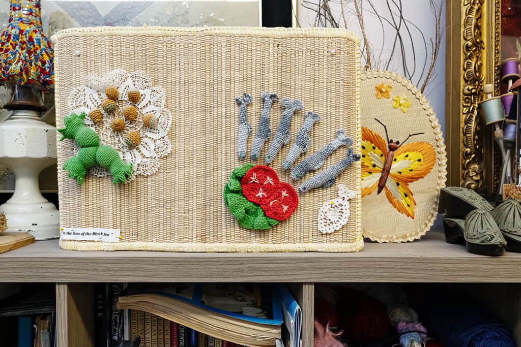 Handmade textile artwork and Oya lace pieces displayed in Ylvia Asal’s studio.
