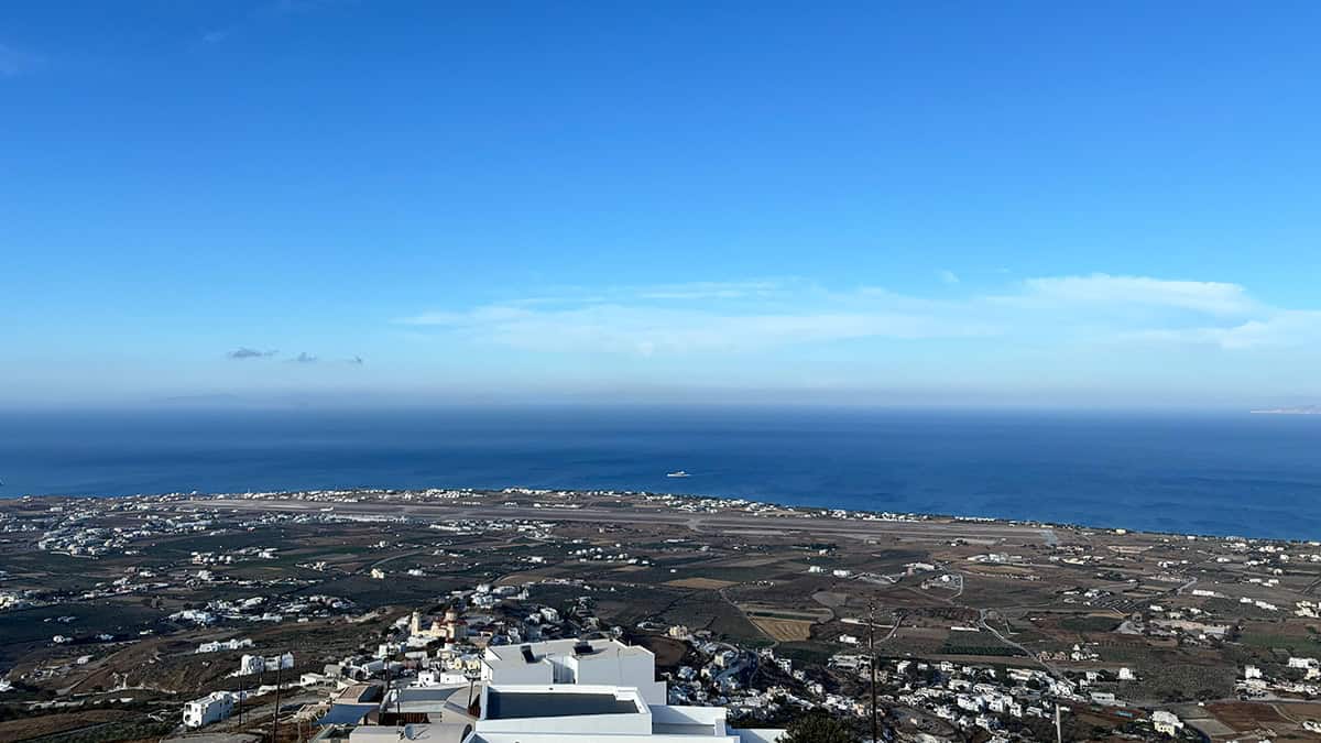 Santorini International Airport runway near the Aegean Sea, seen from above.