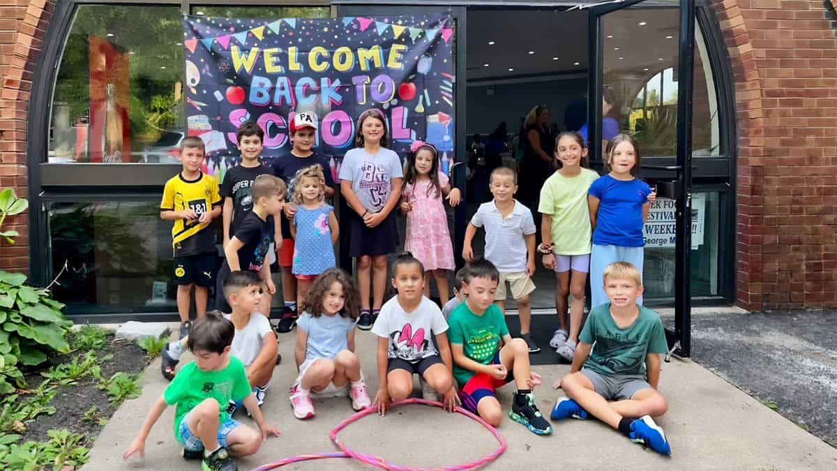 Students from Aristotle Academy at Saint George Greek Orthodox Church in Media, Pennsylvania, gather outside the school.