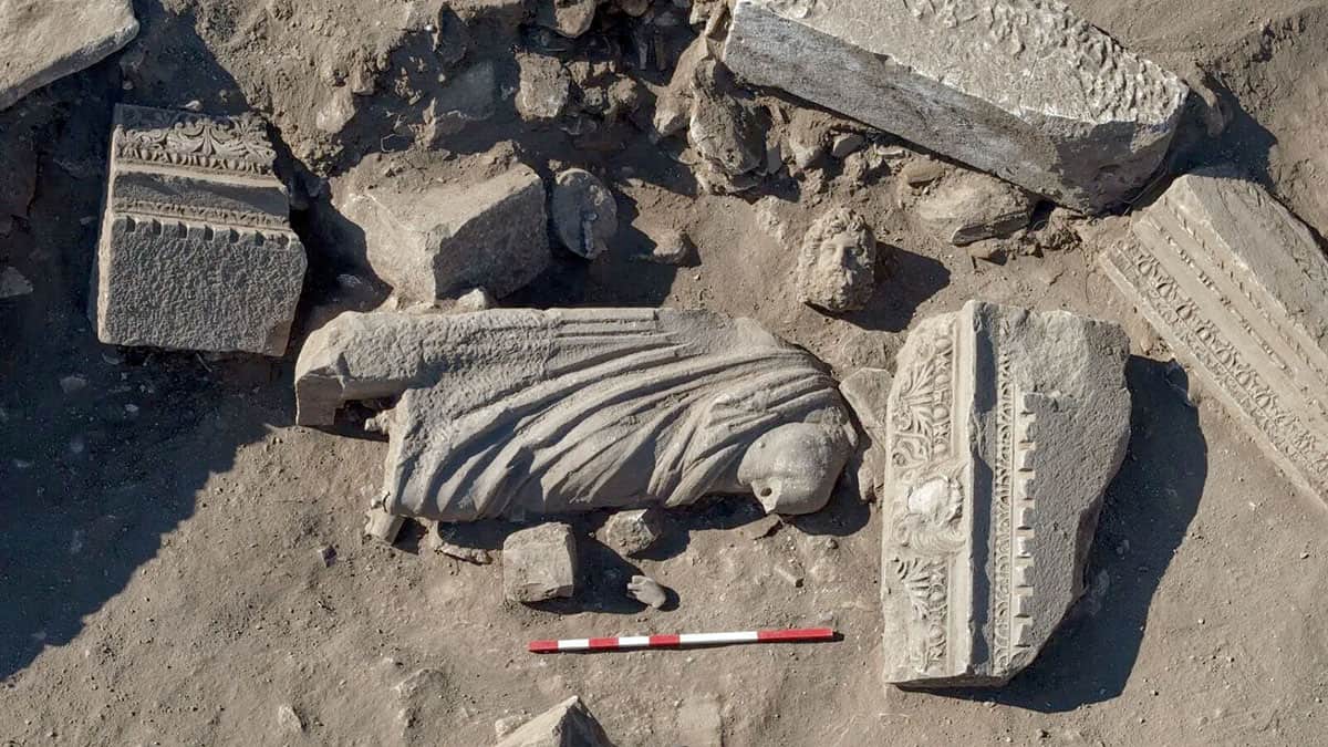 Asklepios and Telesphoros marble statue group lying among architectural remains at ancient Aspendos