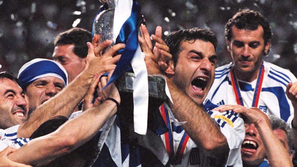 Greek national team players lift the trophy after winning Euro 2004.