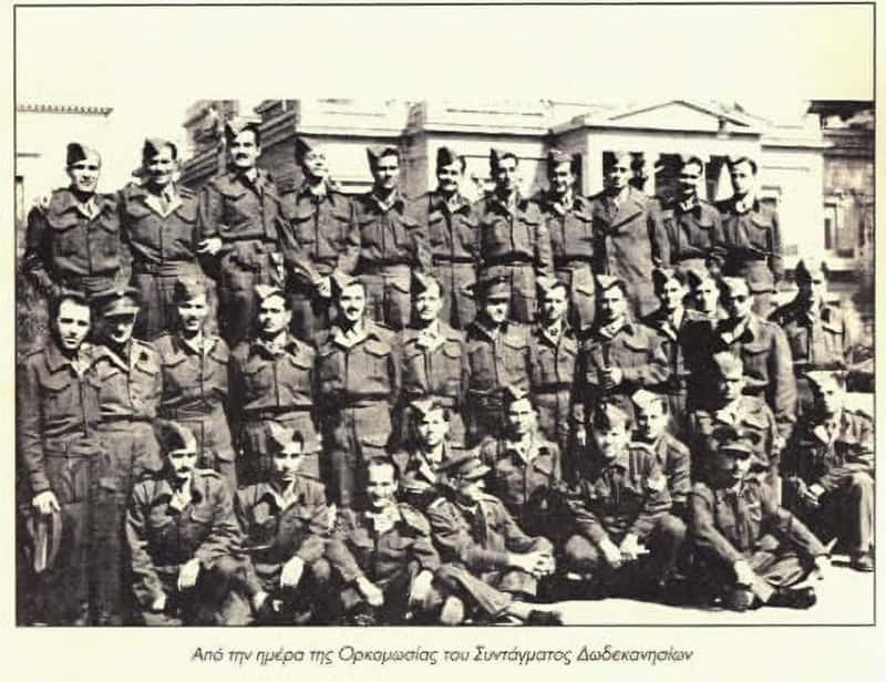 Group of uniformed soldiers from the Dodecanese Volunteer Regiment posing for a photograph on the day of their swearing-in ceremony in 1941.