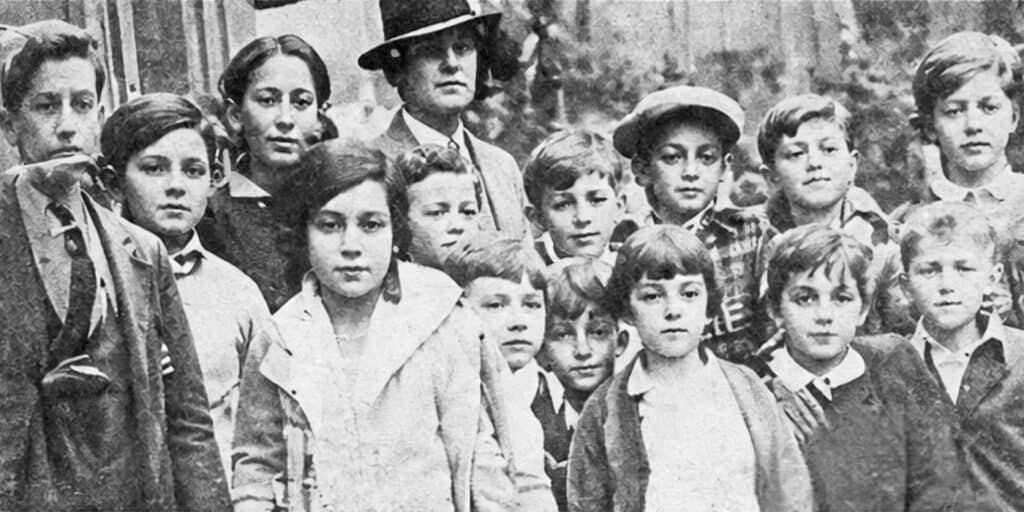 Children rescued from the October 9, 1930, fire at St. George’s Greek Orthodox church and school in Philadelphia, photographed with an adult man.