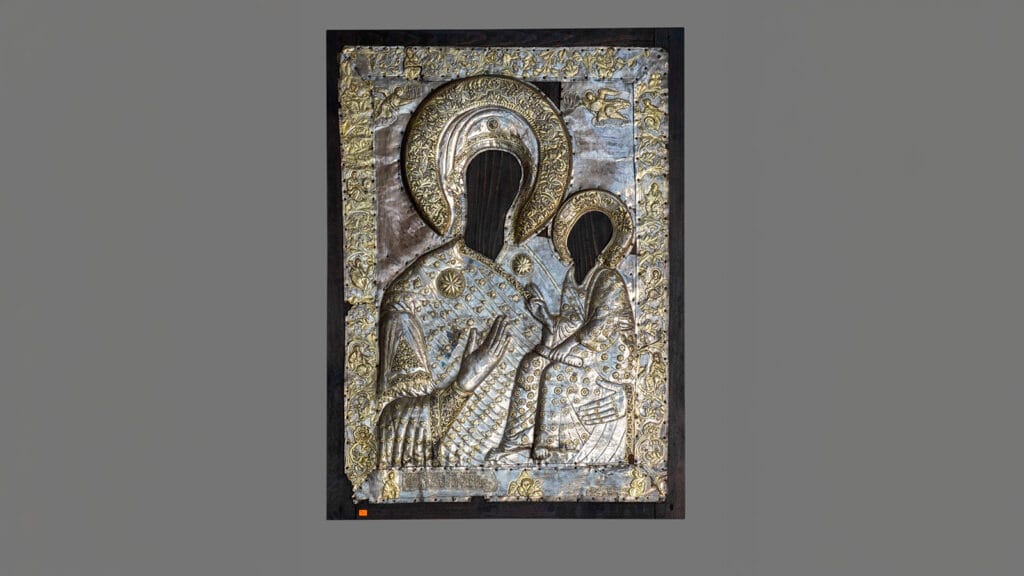 Ornate silver and gold metal covering of an icon of the Virgin Hodegetria and Christ Child, dated 1765.