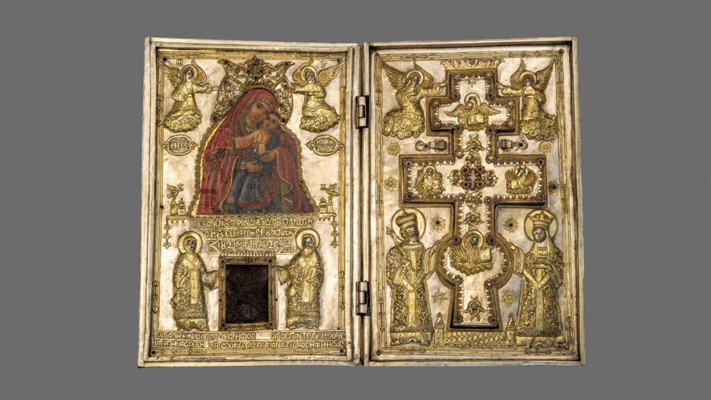 Open silver-gilt reliquary featuring an icon of the Virgin Mary, a piece of wood, and an inset metal cross, dated March 25, 1821.